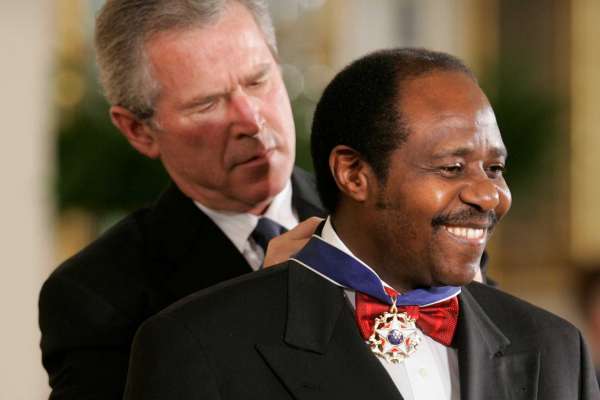 Paul Rusesabagina receiving the Presidential Medal of Honor from President George W. Bush in 2005. Photo Credit -- Lawrence Jackson, AP