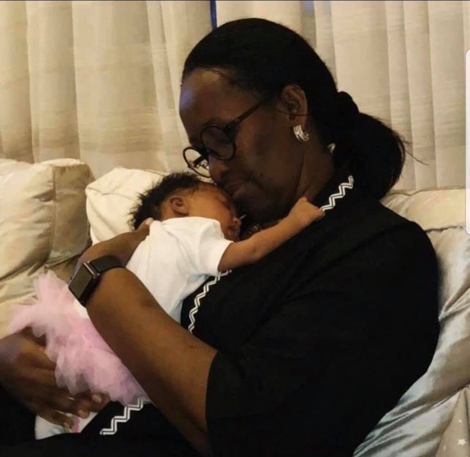 JEANNETTE NZIRORERA KAJUGA GASANA KAGAME HOLDING HER GRANDCHILD WITH AFFECTION