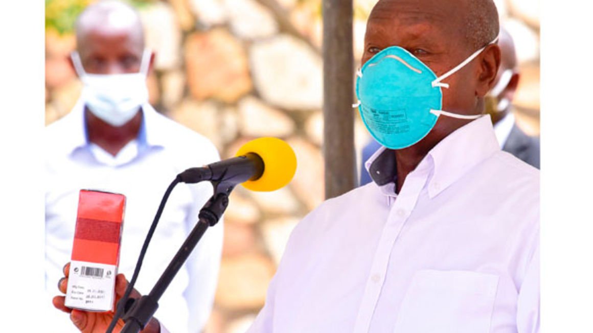 President Museveni displays a sample for the locally-developed product for treatment of Covid-19, viral and bacterial infections at Mualgo hospital yesterday. PHOTO | FILE