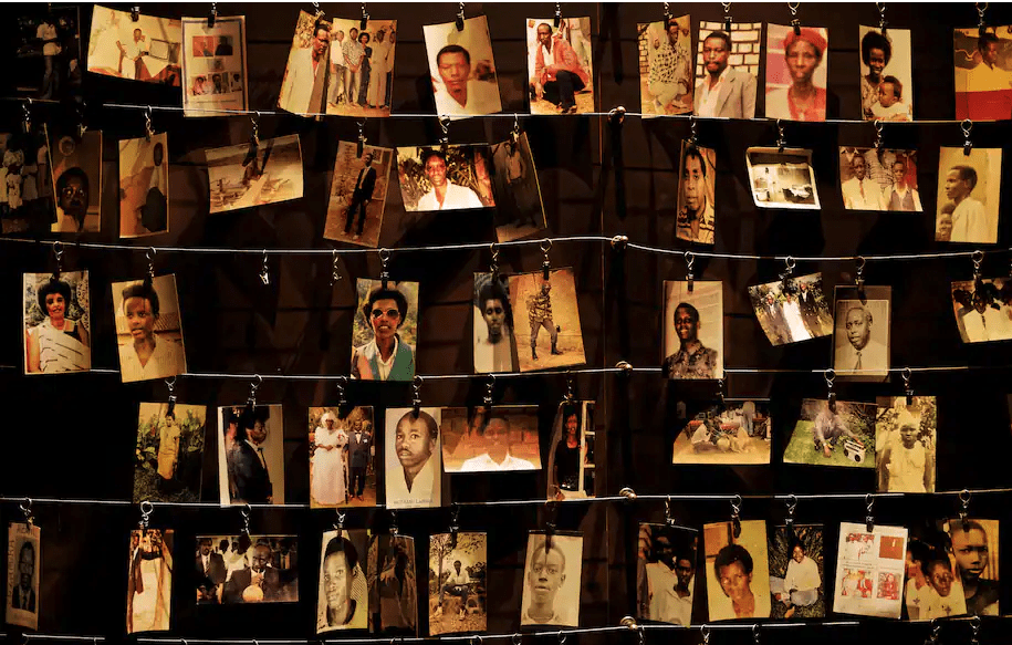 Family photographs of some of those who died during the 1994 genocide hang on display in an exhibition at the Kigali Genocide Memorial center in Rwanda's capital in April 2019